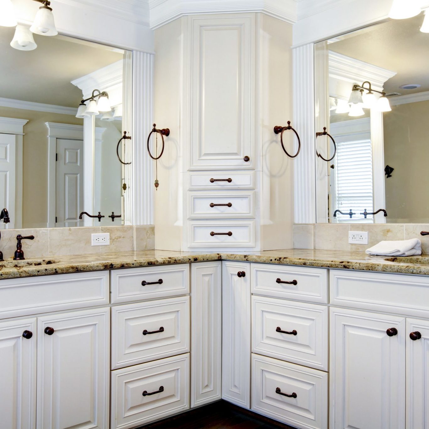 Luxury large white master bathroom cabinets with double sinks.